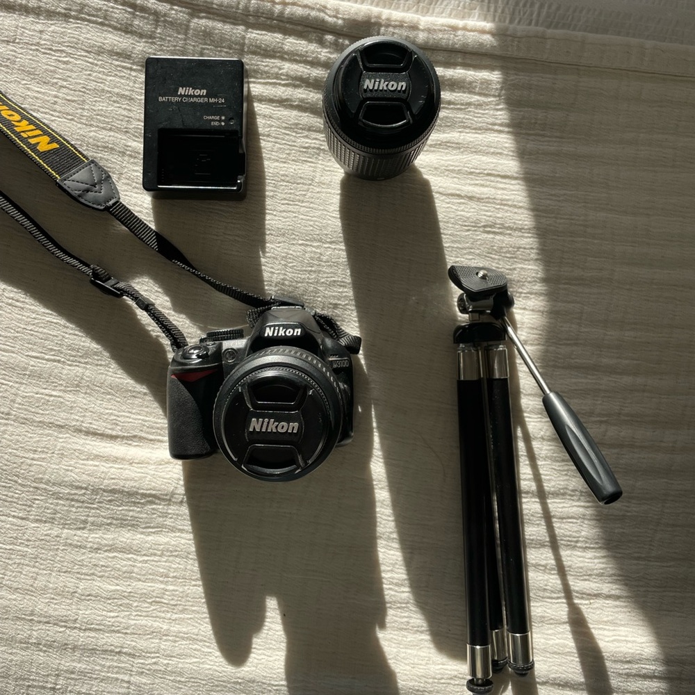 Nikon D3100 with camera bag, charger, lens, and tripod - Picture 1 of 9